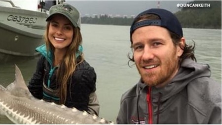 Duncan Keith and Alexandra Stewart catching a big fish